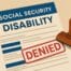 Social Security Disability claim form with a red “Denied” stamp. Illustration representing common reasons disability claims are denied.